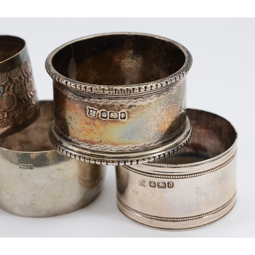 5 - Nine silver napkin rings, various dates, shapes and sizes, to include, Sheffield 1903, Sheffield 198... 