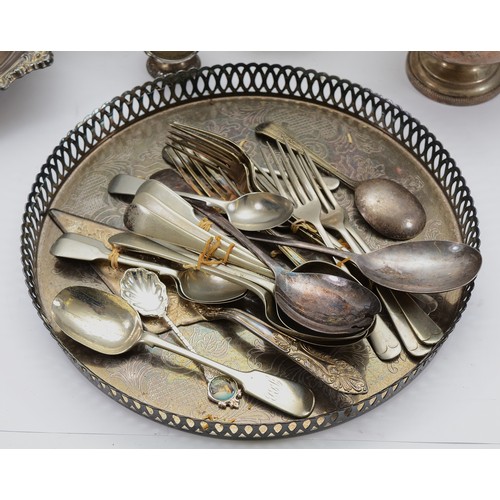 17 - A quantity of silver plated forks, table spoons and tea spoons, together with two plated circular se... 