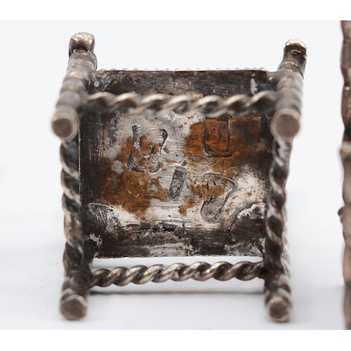 20 - Three Dutch silver miniature chairs, with Hanau markings to the bases, 5x3cm, together with a silver... 