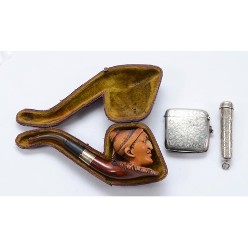 28 - A silver vesta case, Sheffield 1911, together with a silver cheroot case, Sheffield 1898, and a meer... 