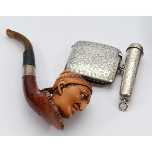 28 - A silver vesta case, Sheffield 1911, together with a silver cheroot case, Sheffield 1898, and a meer... 