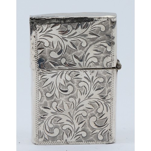 30 - An engraved silver petrol lighter, marked 'sterling 950' having damage to the lid and hinge, 6x4cm.