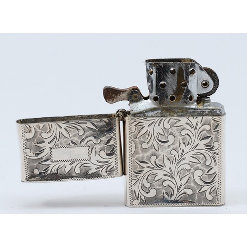 30 - An engraved silver petrol lighter, marked 'sterling 950' having damage to the lid and hinge, 6x4cm.