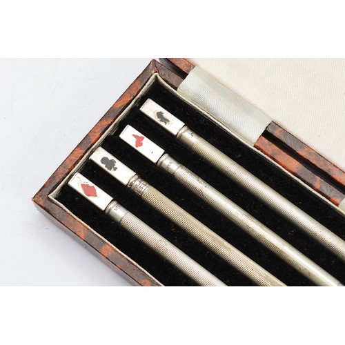 48 - A set of four silver twist action pencils each decorated with the four card suits, stamped SILVER, c... 