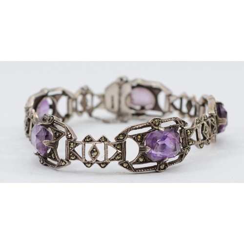 An Art Deco silver, marcasite and amethyst bracelet, composed of five openwork geometric panels18.8gm, stamped SILVER, 16cm, 18.8gm