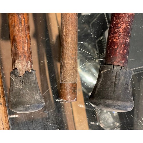 9 - Three wooden crook handled walking canes, having silver band to the tops, Birmingham 1897, 1871, Lon... 