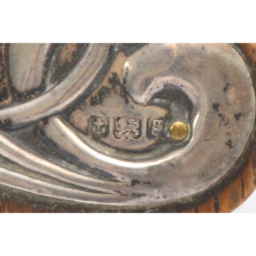 10 - An Art Nouveau silver and enamel oak easel clock, by J. Gloster, Birmingham 1907, with sinuous embos... 