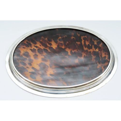 18 - A silver and tortoise shell oval tray, by Mappin & Webb, London 1925, 28x22cm, 316gm total weight.