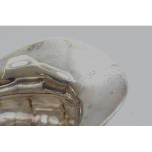 20 - A silver sugar bowl, Birmingham 1934, by  with twin handles, raised on four scroll feet, 20x10cm, to... 