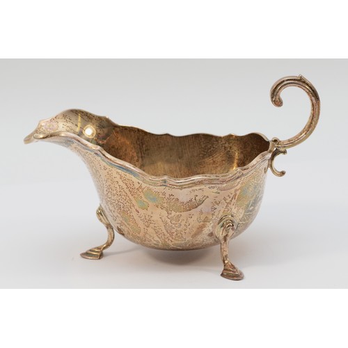 23 - A Scottish silver sauce boat, Glasgow 1925, by Robert Scott, 17x10cm, 191gm.