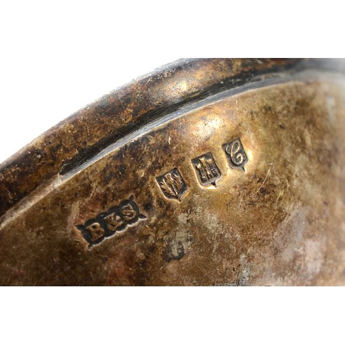 24 - A Scottish silver tea strainer, Edinburgh 1933, by Brook & Son, the handle being in the form of a fi... 