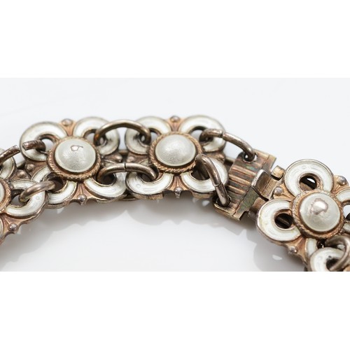 48 - Willy Winnaess for David Andersen, a 925 Norwegian silver and white enamel floral link bracelet, 18c... 