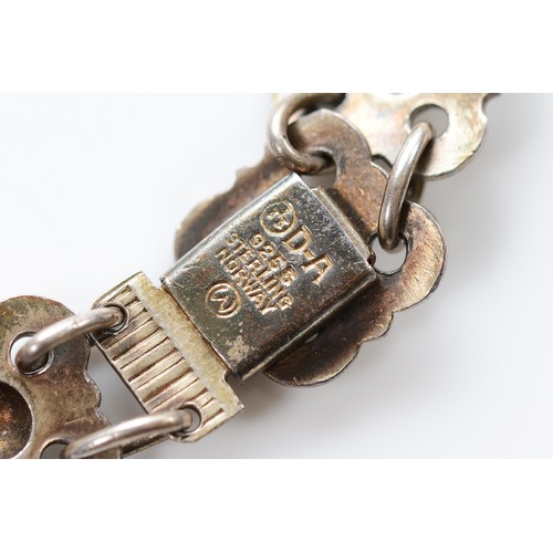 48 - Willy Winnaess for David Andersen, a 925 Norwegian silver and white enamel floral link bracelet, 18c... 
