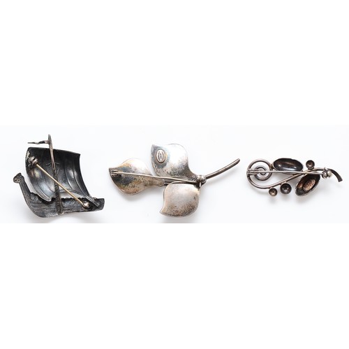 53 - S. Christian Fogh, a Danish Silver leaf brooch, 60mm, FT Denmark, a silver longboat brooch, 40mm, an... 