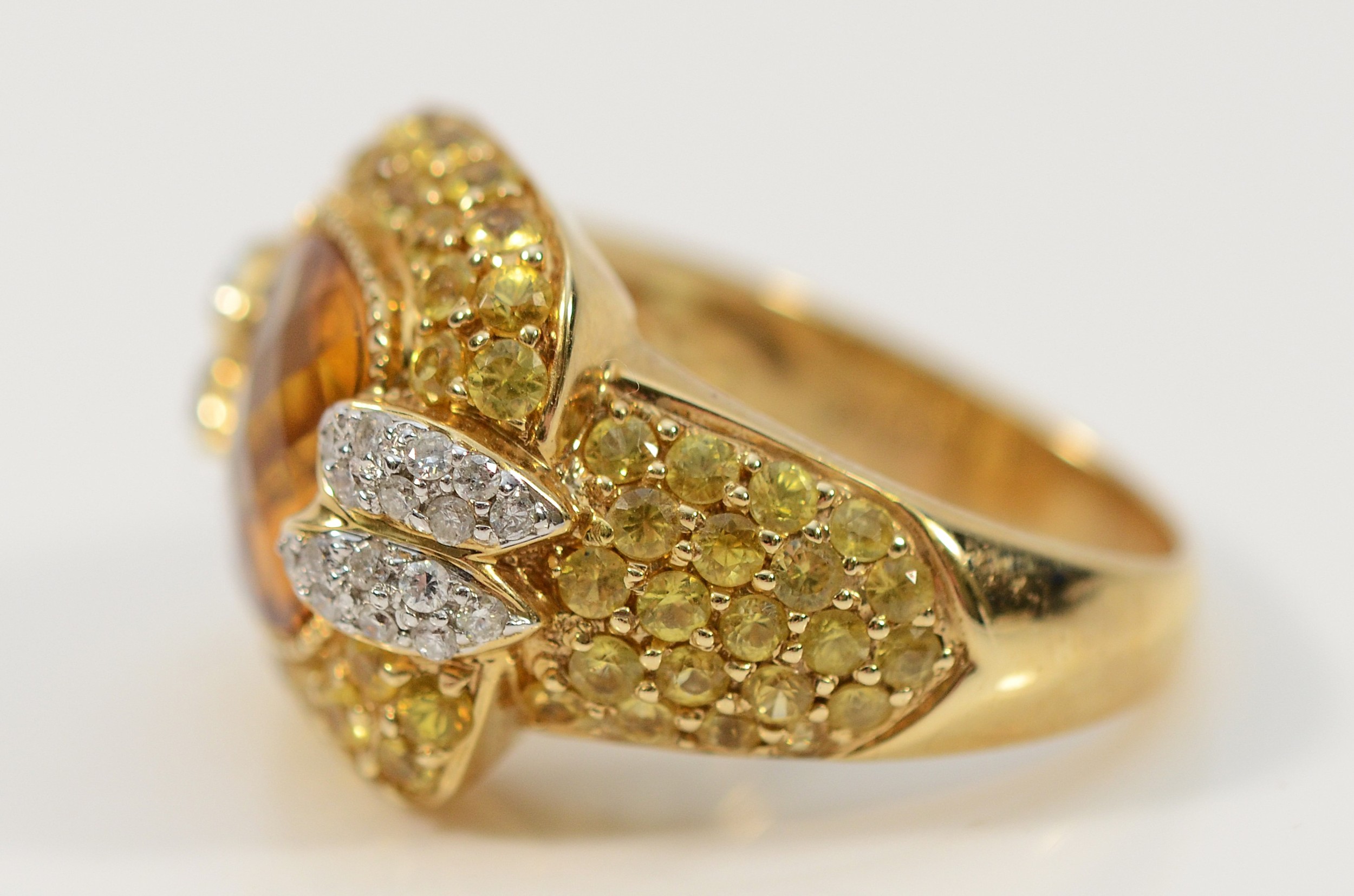 Sonia Bitton, a 14ct gold, citrine, yellow sapphire and diamond dress ...