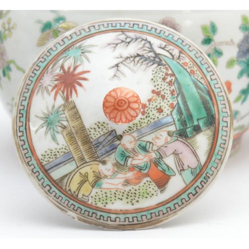 380 - A Chinese set of three famile vert lidded jars, six character Qianlong Mark, decorated with birds am... 