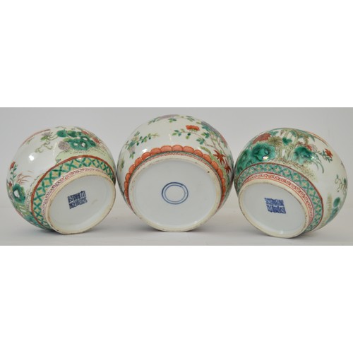 380 - A Chinese set of three famile vert lidded jars, six character Qianlong Mark, decorated with birds am... 