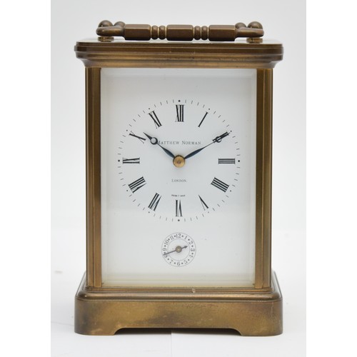 384 - Matthew Norman, a brass alarm and striking carriage clock, signed white enamel dial with Roman numer... 