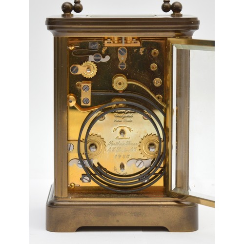 384 - Matthew Norman, a brass alarm and striking carriage clock, signed white enamel dial with Roman numer... 