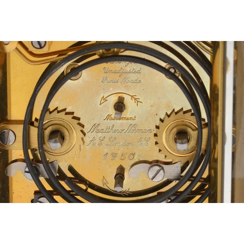 384 - Matthew Norman, a brass alarm and striking carriage clock, signed white enamel dial with Roman numer... 