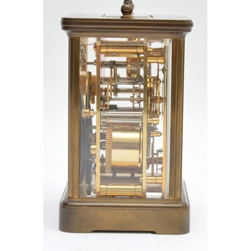 384 - Matthew Norman, a brass alarm and striking carriage clock, signed white enamel dial with Roman numer... 