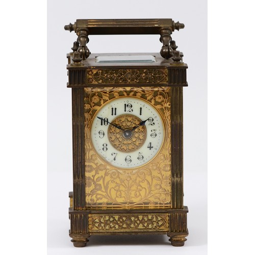 385 - A late 19th century brass carriage timepiece, the off white chapter ring with Arabic numerals, pierc... 
