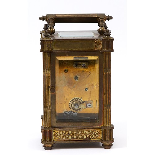 385 - A late 19th century brass carriage timepiece, the off white chapter ring with Arabic numerals, pierc... 