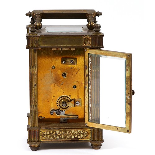 385 - A late 19th century brass carriage timepiece, the off white chapter ring with Arabic numerals, pierc... 