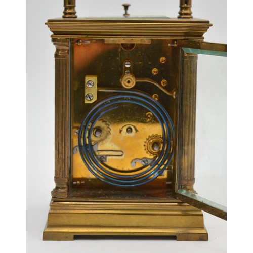 386 - An early 20th century brass repeating and striking carriage clock, white enamel dial with Roman nume... 