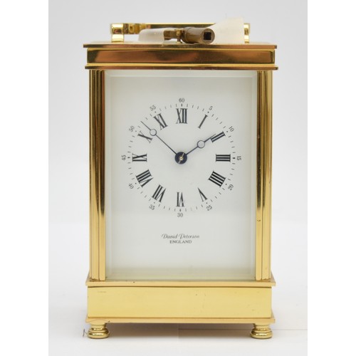 395 - David Peterson, an English brass repeating and striking carriage clock, signed white enamel dial wit... 
