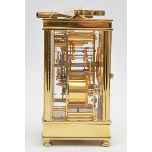 395 - David Peterson, an English brass repeating and striking carriage clock, signed white enamel dial wit... 