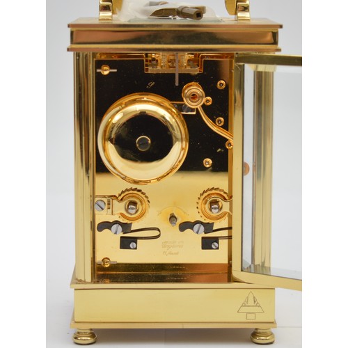 395 - David Peterson, an English brass repeating and striking carriage clock, signed white enamel dial wit... 