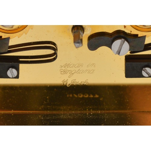 395 - David Peterson, an English brass repeating and striking carriage clock, signed white enamel dial wit... 