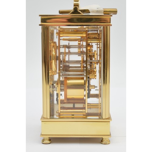 395 - David Peterson, an English brass repeating and striking carriage clock, signed white enamel dial wit... 