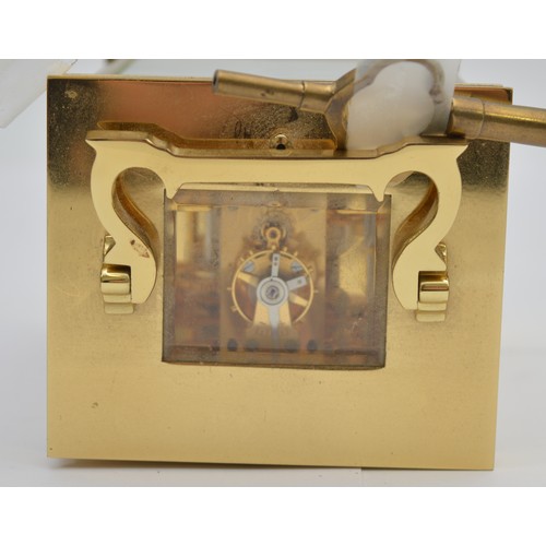 395 - David Peterson, an English brass repeating and striking carriage clock, signed white enamel dial wit... 