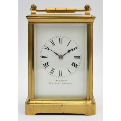 396 - An early 20th century brass striking carriage clock, the white enamel dial signed David Innes, Londo... 