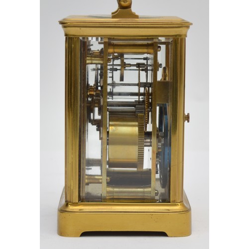 396 - An early 20th century brass striking carriage clock, the white enamel dial signed David Innes, Londo... 
