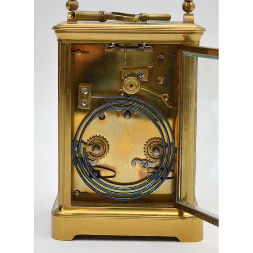 396 - An early 20th century brass striking carriage clock, the white enamel dial signed David Innes, Londo... 