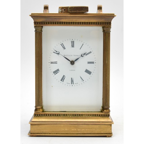 398 - Mathew Norman, London, a 20th century  brass repeating and striking carriage clock, signed enameled ... 