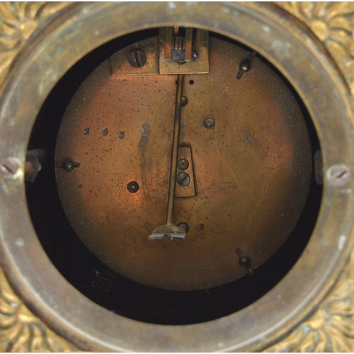 409 - A late 19th century French cast brass mantel timepiece, with lion mask handles, raised on scroll fee... 