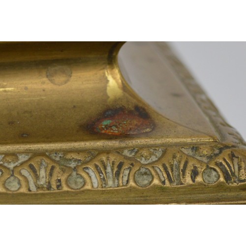 409 - A late 19th century French cast brass mantel timepiece, with lion mask handles, raised on scroll fee... 