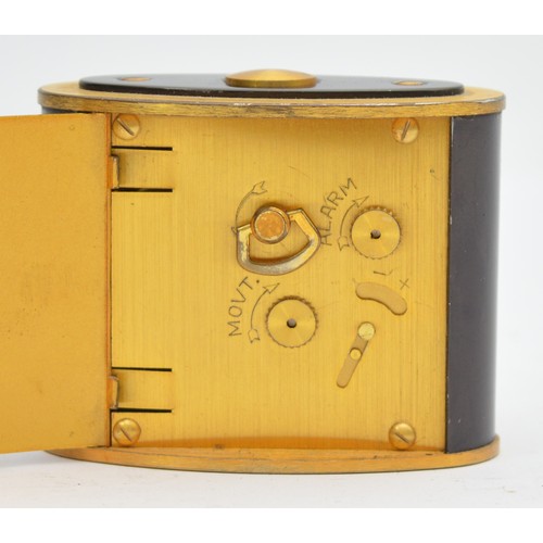 416 - Jaeger, a brass and black oval alarm clock, c.1950's, 6 x 3.5 x 4.5cm.
In working order, but not gua... 