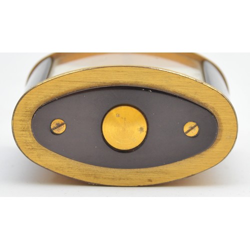 416 - Jaeger, a brass and black oval alarm clock, c.1950's, 6 x 3.5 x 4.5cm.
In working order, but not gua... 