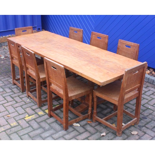 'Rabbitman' Peter Heap, Wetwang; an oak dining table, the pegged rectangular adzed top on octagonal supports carved with rabbit signature, sledge feet united by floor stretcher, L244, D86, H74cm, together with a set of eight dining chairs, having panelled backrests, solid adzed seats on carved octagonal block supports, each with carved rabbit signature, H84, W45, D41cm. (9)
This set was a special order by our vendors parents c.1970/74.