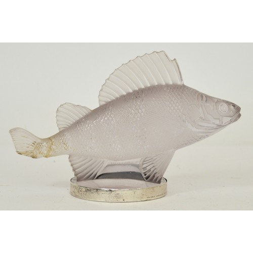 René Lalique (1860-1945); an Art Deco Perche Poisson/Perch glass car mascot, modelled as a fish, in clear and frosted glass, with etched signature to the side, c. 1929-35, with silver plate frame to base, engraved retailer's name Mellerio Hermands Paris-Madrid, design introduced on 20/4/1929, model no. 1158, l. 16cm.

See Brian Jewell, 'Motor Badges and Figureheads', Midas Books: Kent, 1978, p. 58.