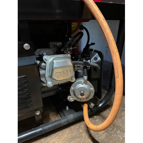 10 - A Bohmer AG 6500W generator with 8HP engine, 12V and 230V output, together with a gas pipe and regul... 