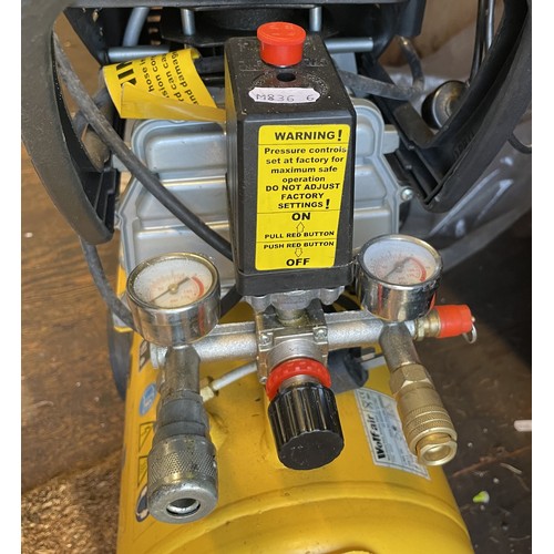 17 - A small Wolf compressor with 24L tank, single phase 13A, with pip and tyre inflator.
