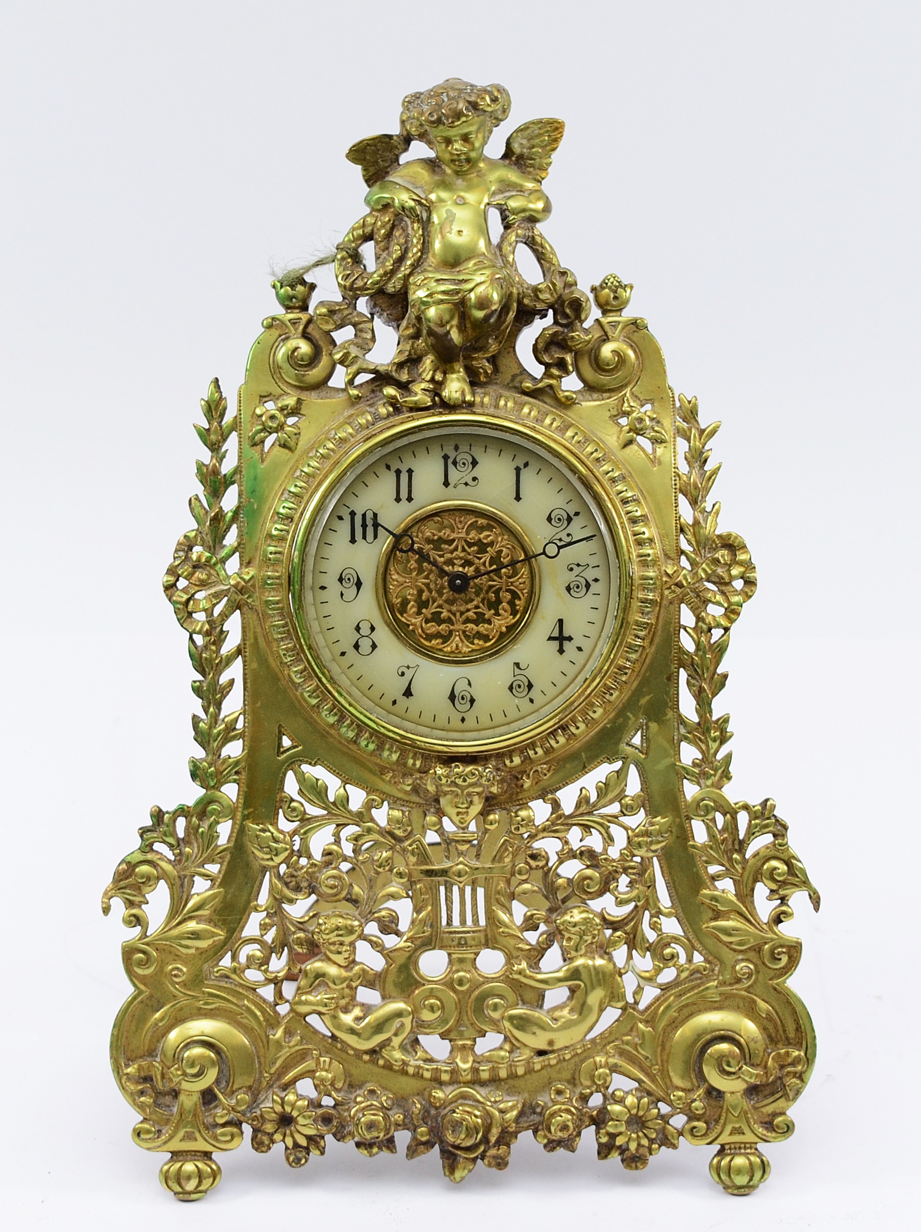 A late 19th century French 8 day brass easel mantel clock, ornate ...