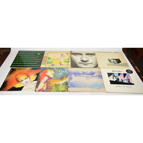 A collection of over thirty Vinyl LP's, mostly rock and prog rock, to ...