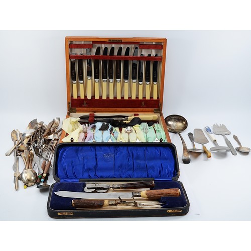 A stainless steel and horn carving set, with embossed silver band